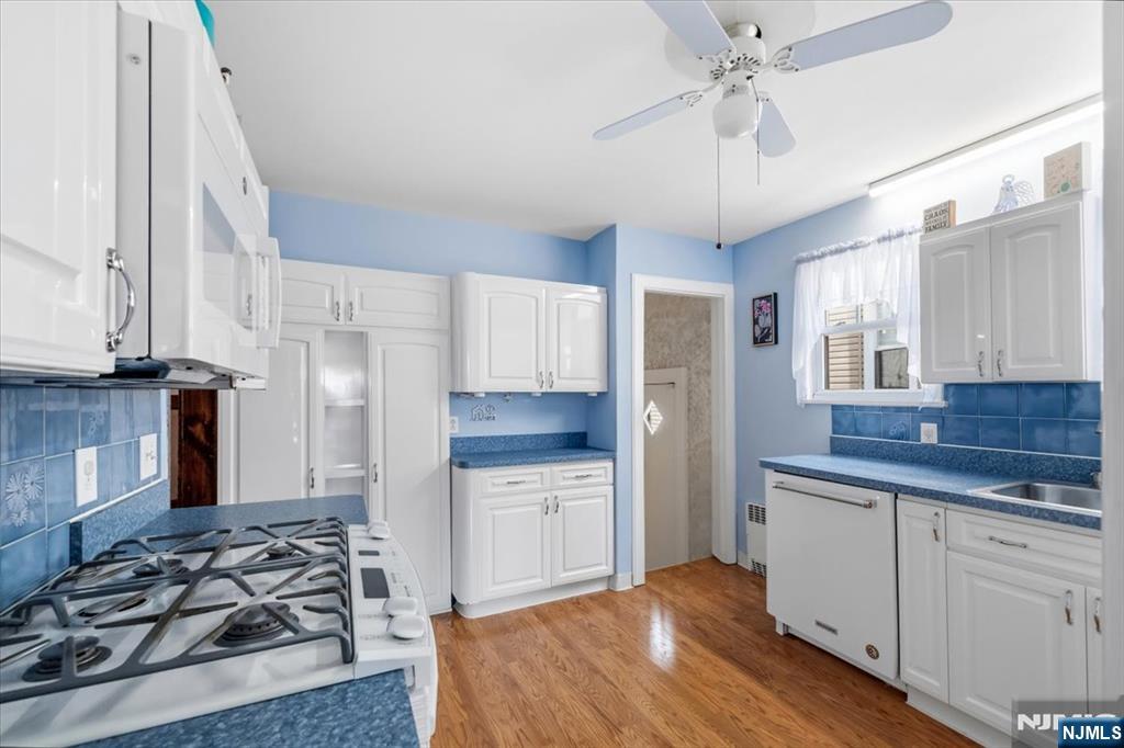 119 Overpeck Avenue Ridgefield Park, NJ 07660 - Photo 13 of 44 a kitchen with stainless steel appliances granite countertop a sink stove and refrigerator
