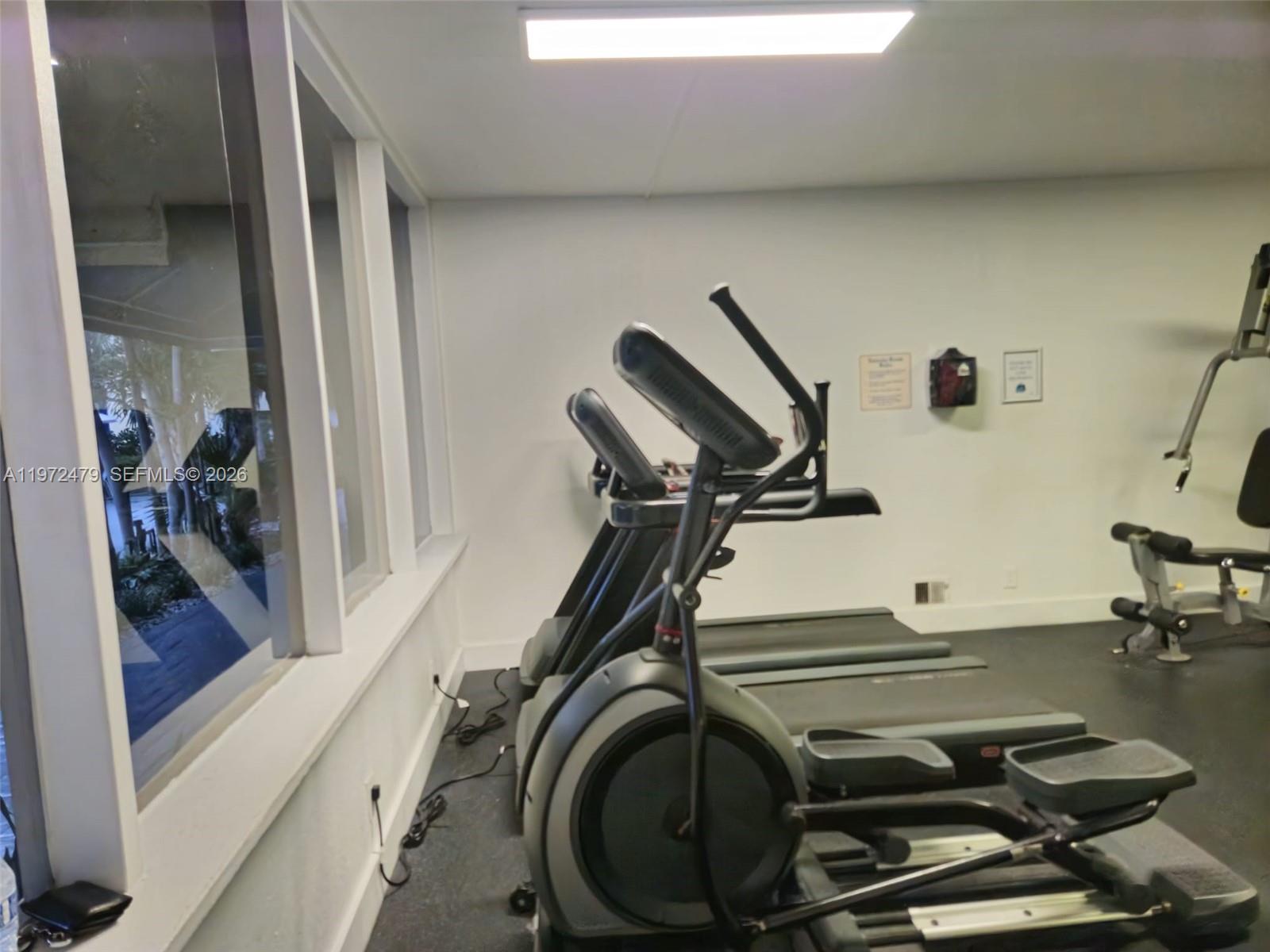 4550 Northwest 9th Street, Unit 704E Miami, FL 33126 - Photo 20 of 21 a view of a room with gym equipment