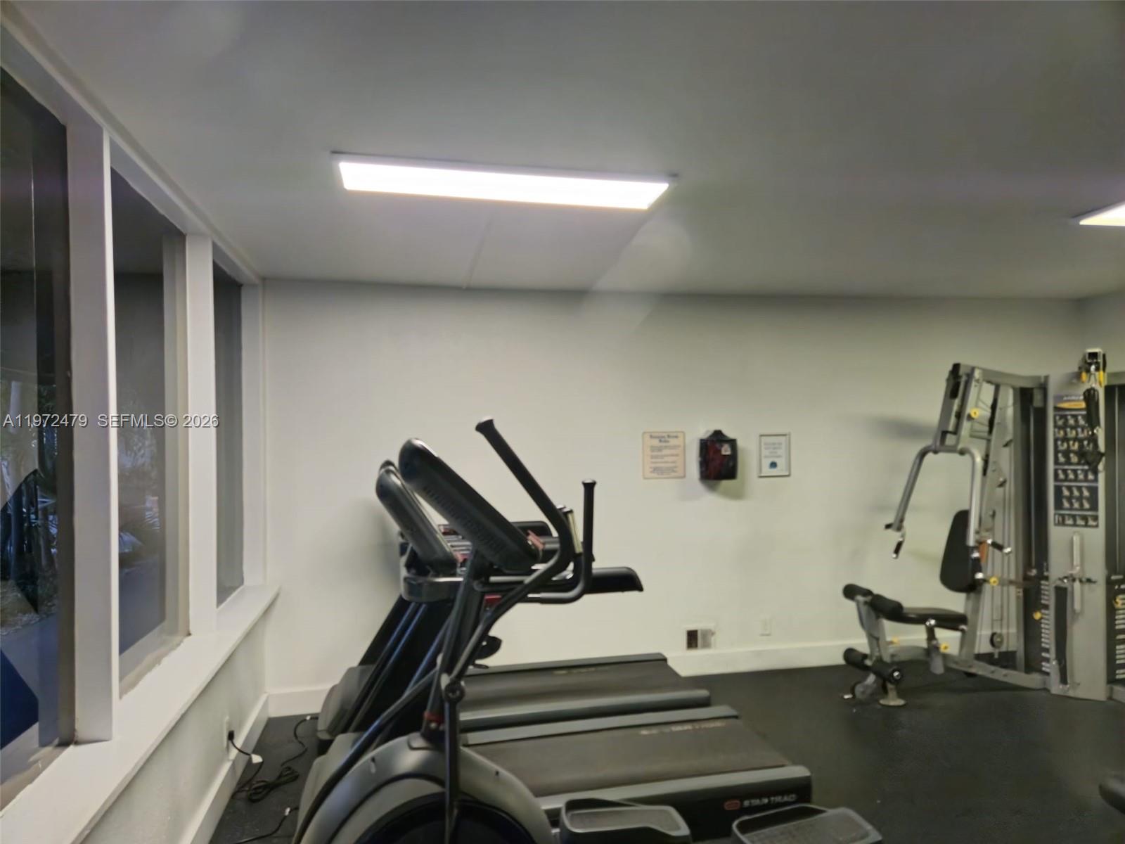 4550 Northwest 9th Street, Unit 704E Miami, FL 33126 - Photo 9 of 21 a view of a room with gym equipment