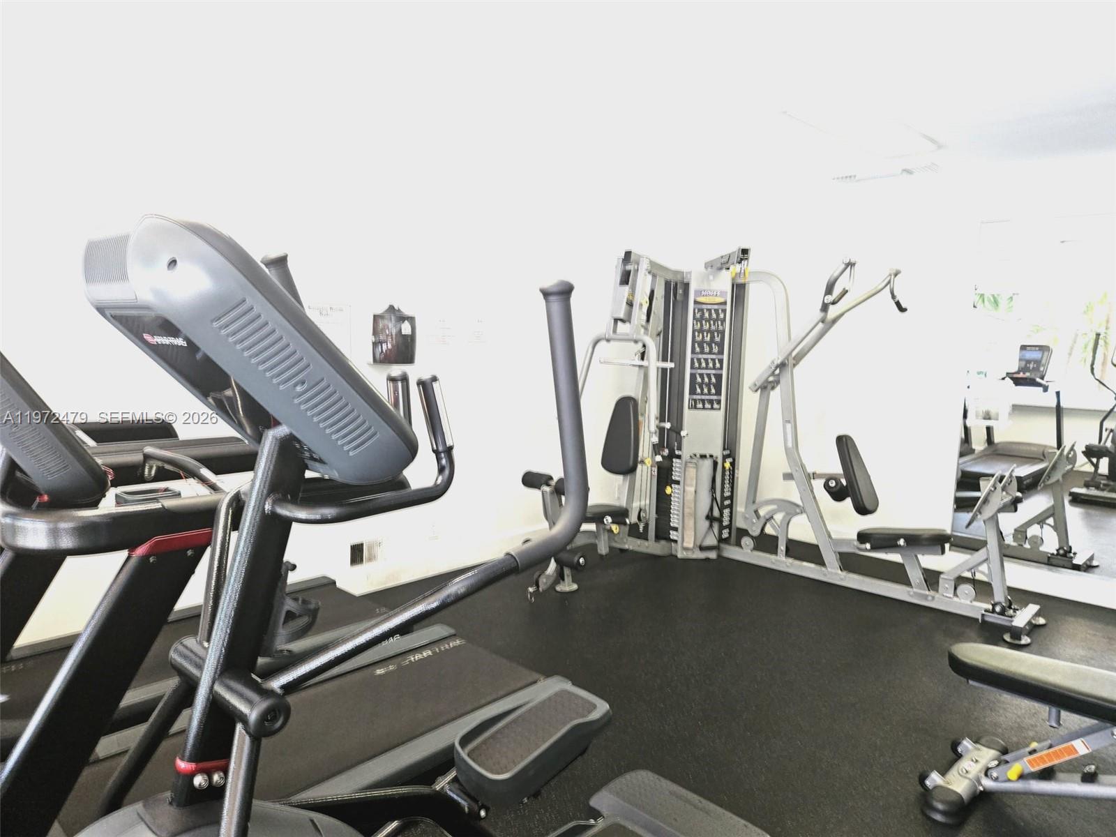 4550 Northwest 9th Street, Unit 704E Miami, FL 33126 - Photo 10 of 21 a view of a room with gym equipment