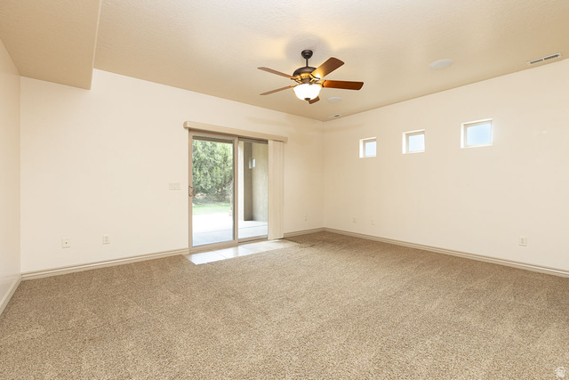 888 East Fiddlers Canyon Road Cedar City, UT 84721 - Photo 47 of 74 Unfurnished room with a ceiling fan and light colored carpet