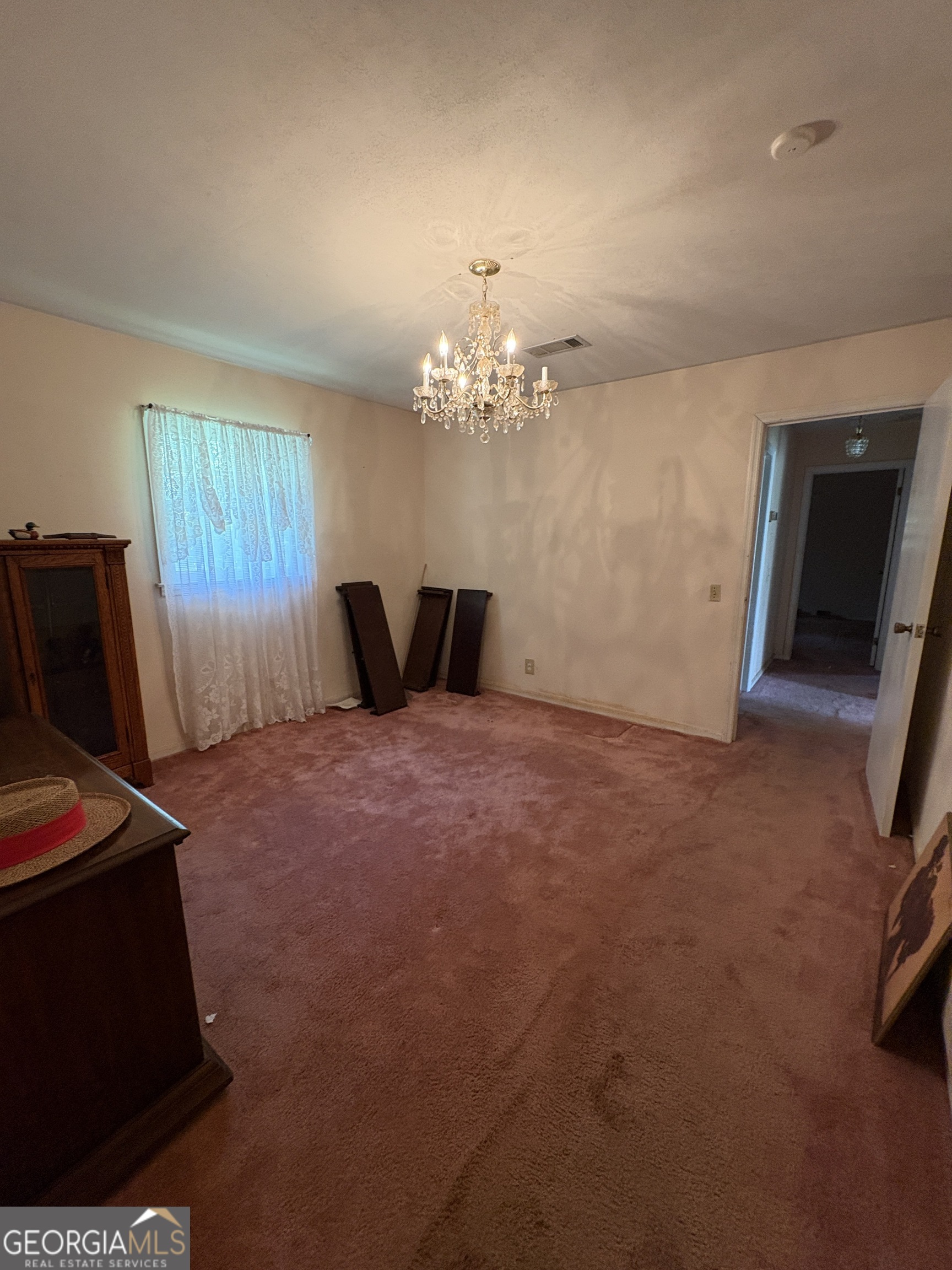 5735 Fitzgerald Street Eastman, GA 31023 - Photo 14 of 22 a bedroom with bed and window