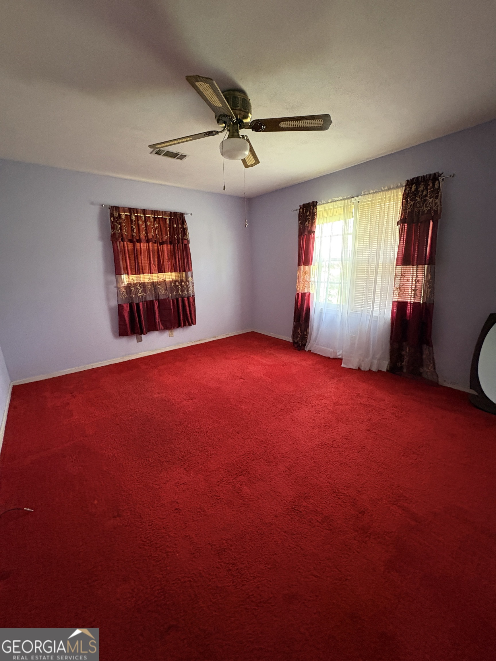 5735 Fitzgerald Street Eastman, GA 31023 - Photo 18 of 22 a view of empty room with window and ceiling fan