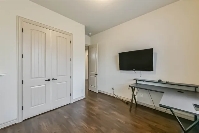 a view of an empty room with windows