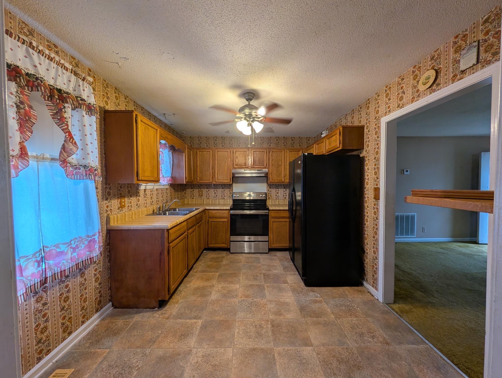 2622 Union Hall Road Clarksville, TN 37040 - Photo 12 of 12 a large kitchen with a cabinets and stainless steel appliances