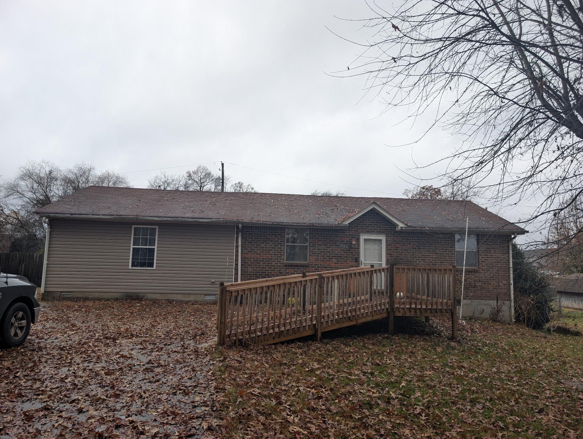 2622 Union Hall Road Clarksville, TN 37040 - Photo 5 of 12 a view of a house with wooden fence and a bench
