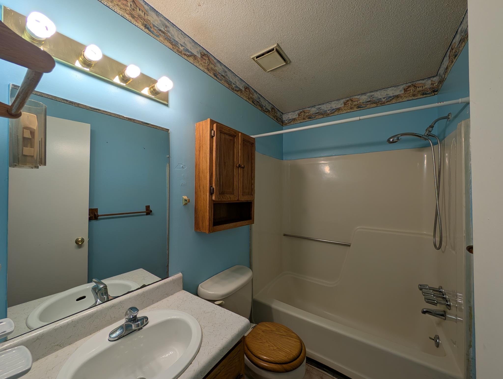 2622 Union Hall Road Clarksville, TN 37040 - Photo 9 of 12 a bathroom with a sink toilet and shower