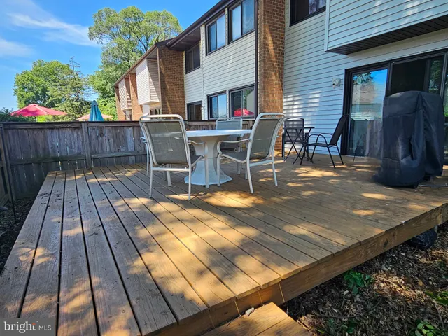 a view of a patio with wooden floor
