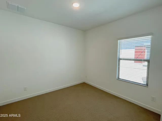 an empty room with closet area