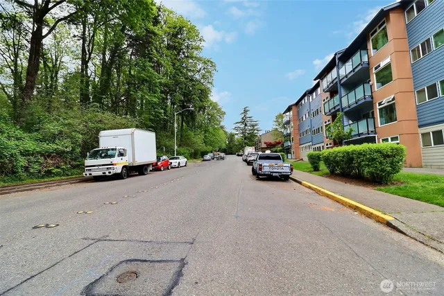 a car parked in front of a white building
