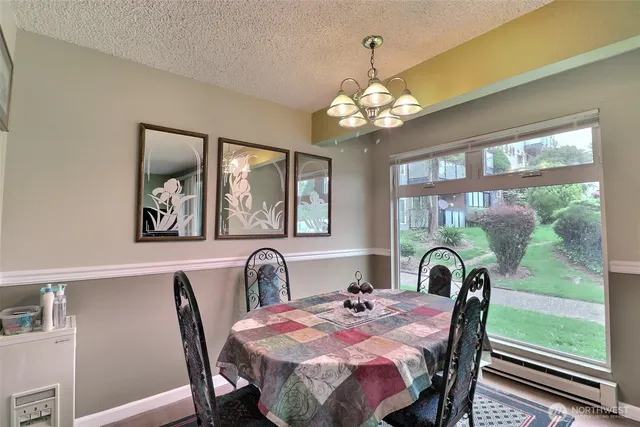 a kitchen with sink refrigerator and stove