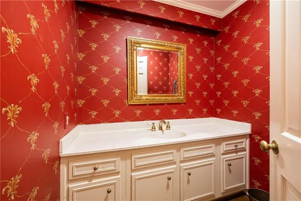 a bathroom with a sink a vanity and a mirror