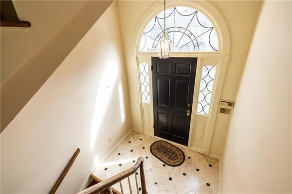 an empty room with a empty space and windows