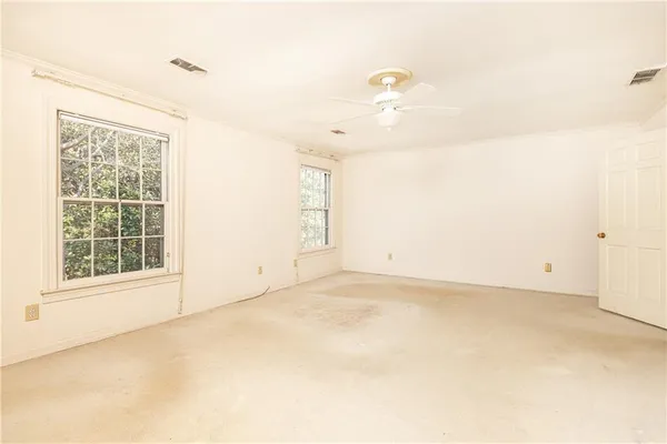 a spacious bathroom with a shower sink and mirror