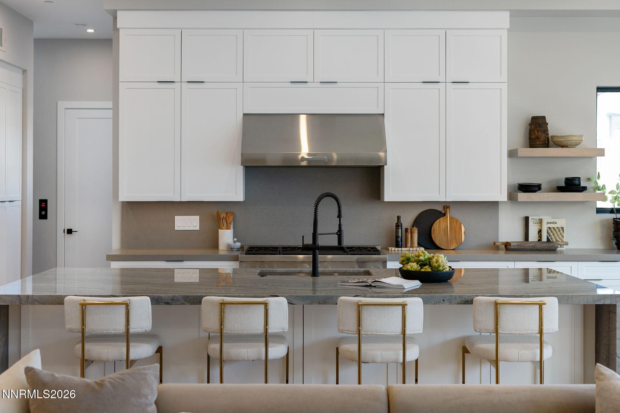 42 Campolina Street Reno, NV 89511 - Photo 15 of 52 a kitchen with stainless steel appliances granite countertop a table and chairs