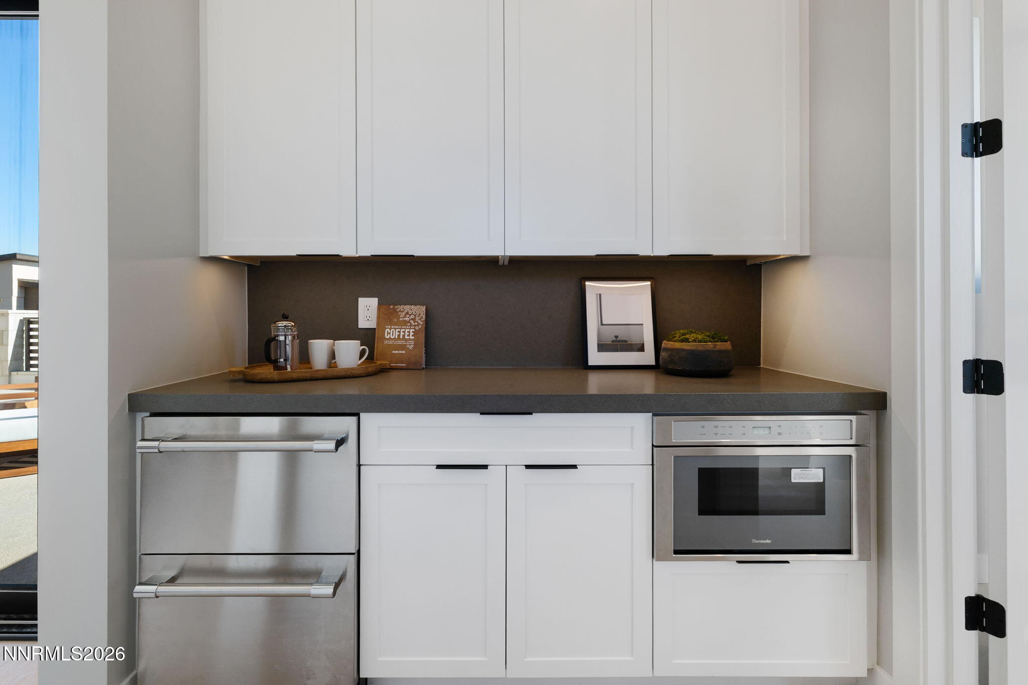 42 Campolina Street Reno, NV 89511 - Photo 39 of 52 a kitchen with stainless steel appliances granite countertop a stove a refrigerator and a microwave
