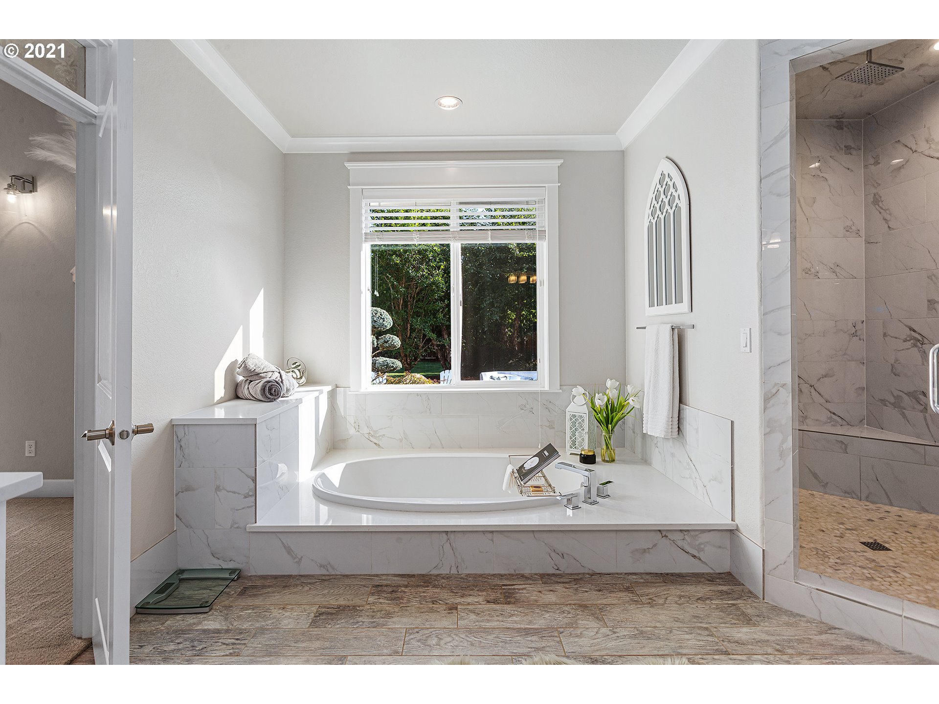 15849 South Harding Road Oregon City, OR 97045 - Photo 13 of 32 a white bath tub sitting in a bathroom next to a window