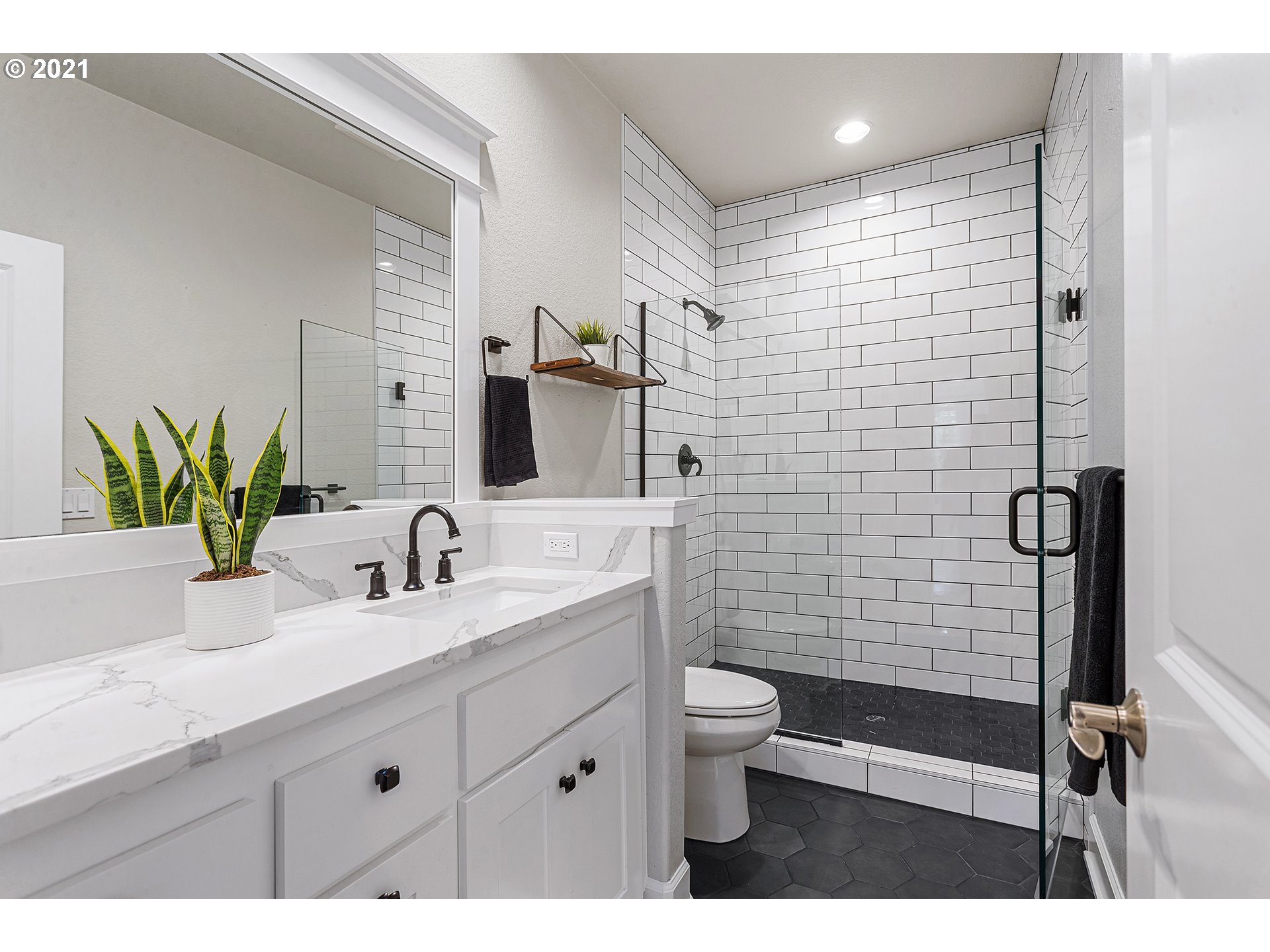 15849 South Harding Road Oregon City, OR 97045 - Photo 16 of 32 a bathroom with a double vanity sink toilet and shower