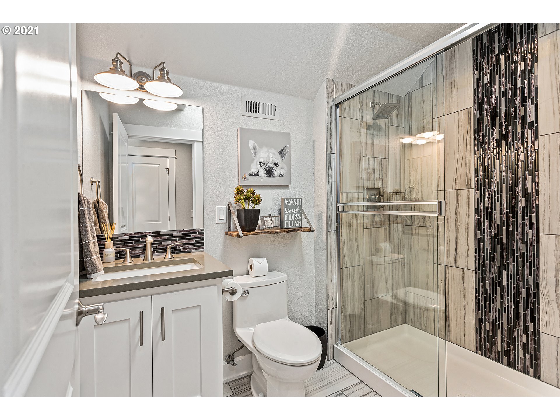 15849 South Harding Road Oregon City, OR 97045 - Photo 20 of 32 a bathroom with a sink toilet a mirror and shower