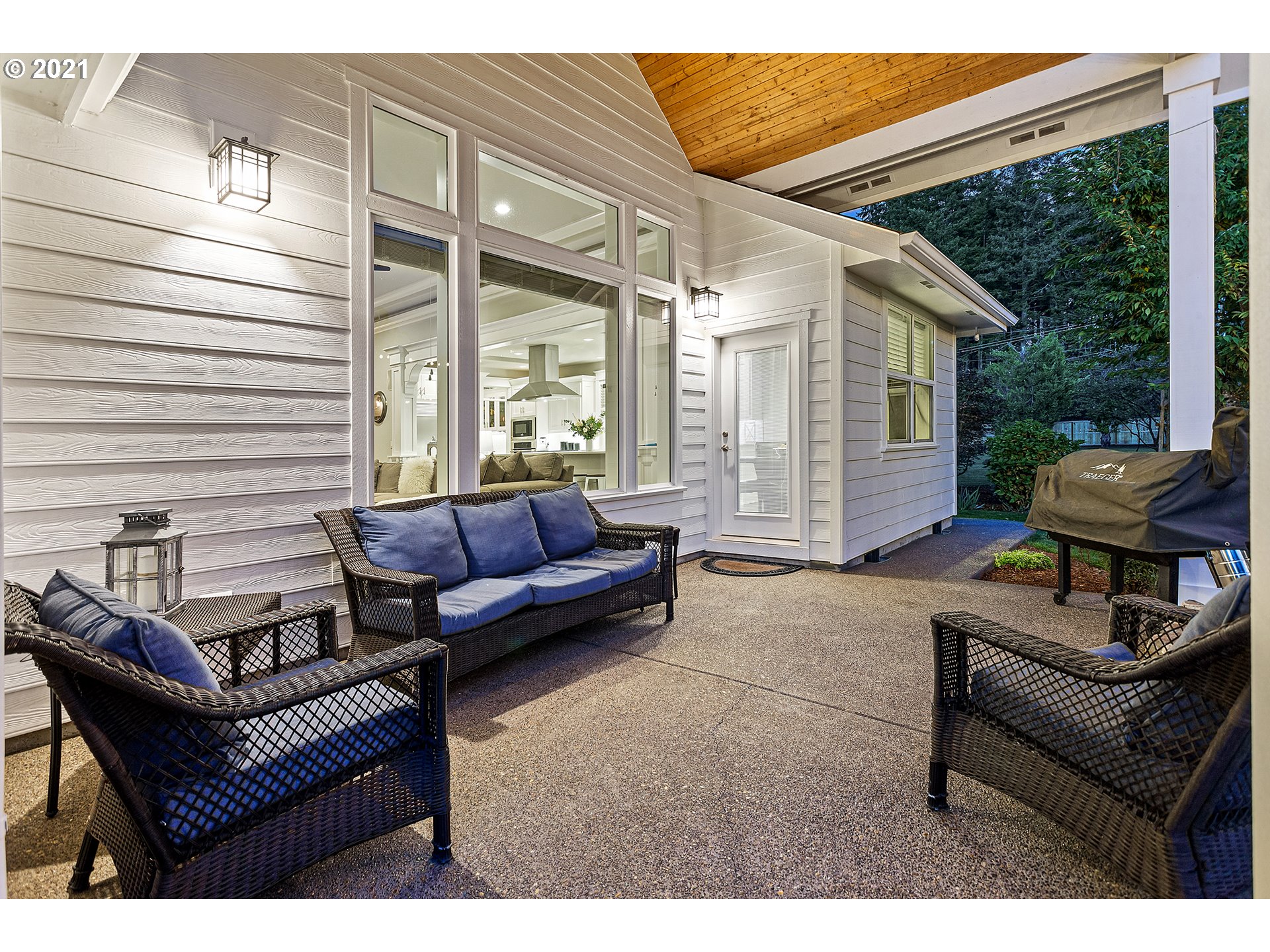 15849 South Harding Road Oregon City, OR 97045 - Photo 22 of 32 a outdoor living space with patio furniture and a wooden floor