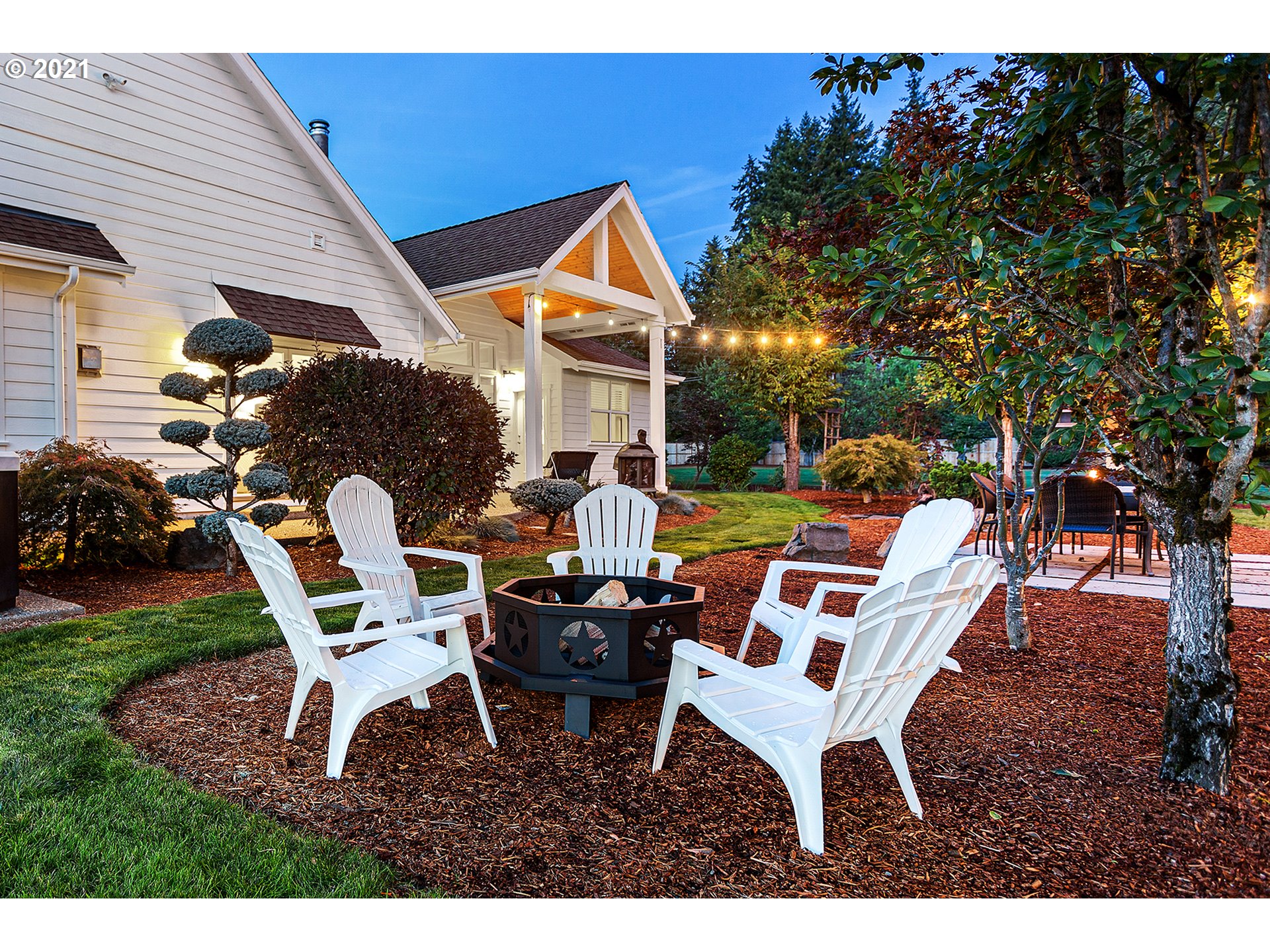 15849 South Harding Road Oregon City, OR 97045 - Photo 25 of 32 a backyard of a house with a yard table and chairs
