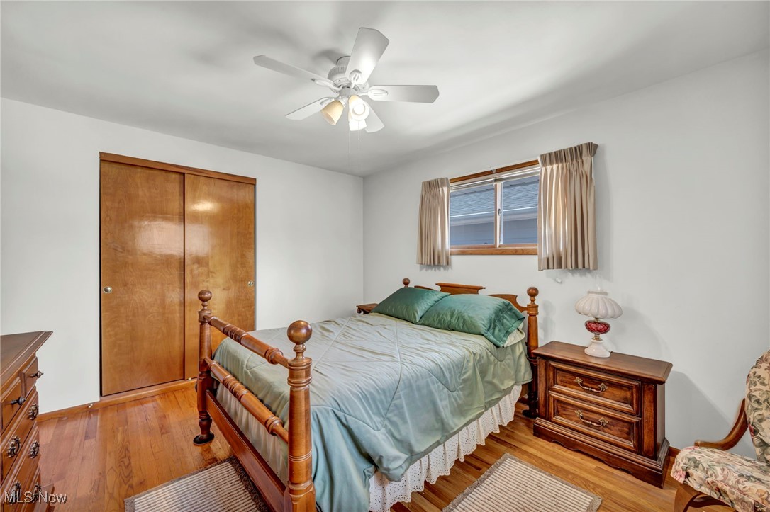 13732 Carpenter Road Garfield Heights, OH 44125 - Photo 22 of 46 Bedroom with a closet, light wood-style floors, and a ceiling fan