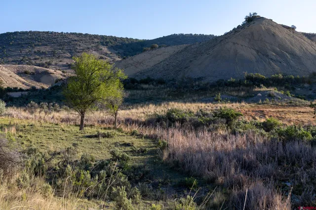 a view of a house with sitting area and roof