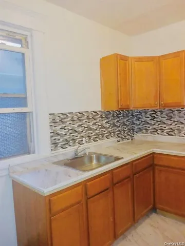 a kitchen with a sink and cabinets