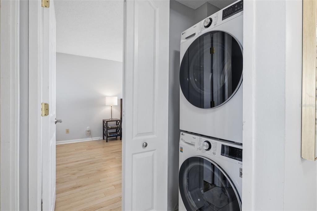 9495 Blind Pass Road, Unit 905 St. Pete Beach, FL 33706 - Photo 25 of 59 a utility room with dryer and washer