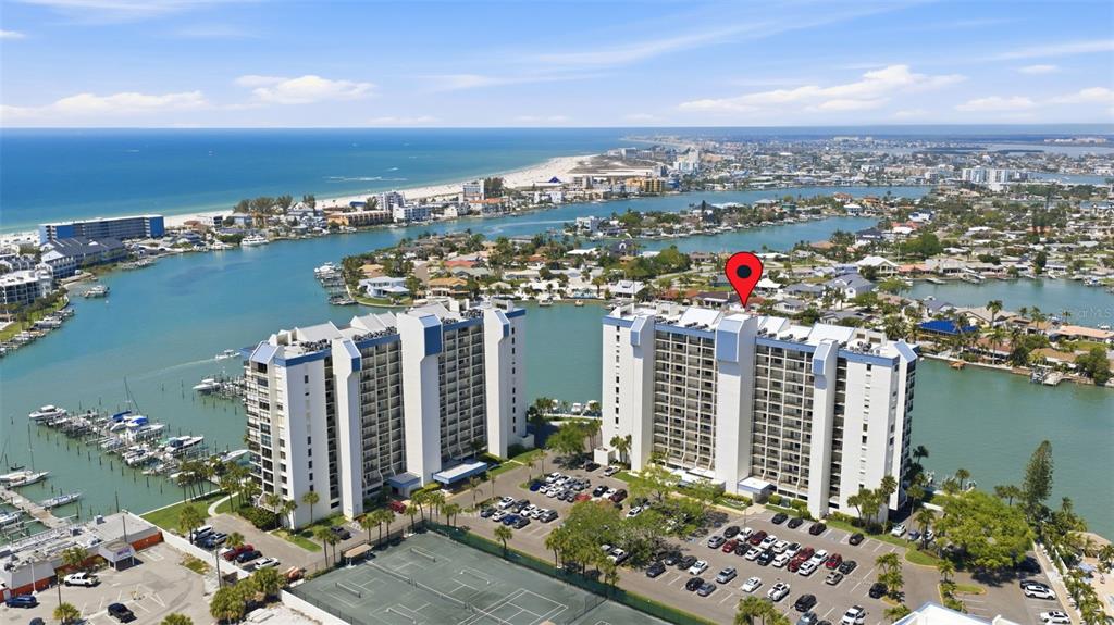 9495 Blind Pass Road, Unit 905 St. Pete Beach, FL 33706 - Photo 33 of 59 a view of a city and an ocean view