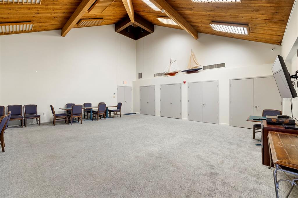 9495 Blind Pass Road, Unit 905 St. Pete Beach, FL 33706 - Photo 47 of 59 a view of a livingroom with storage space