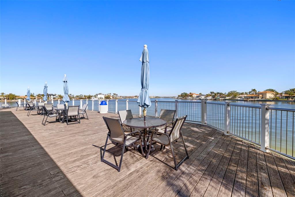 9495 Blind Pass Road, Unit 905 St. Pete Beach, FL 33706 - Photo 53 of 59 a view of a terrace with seating area