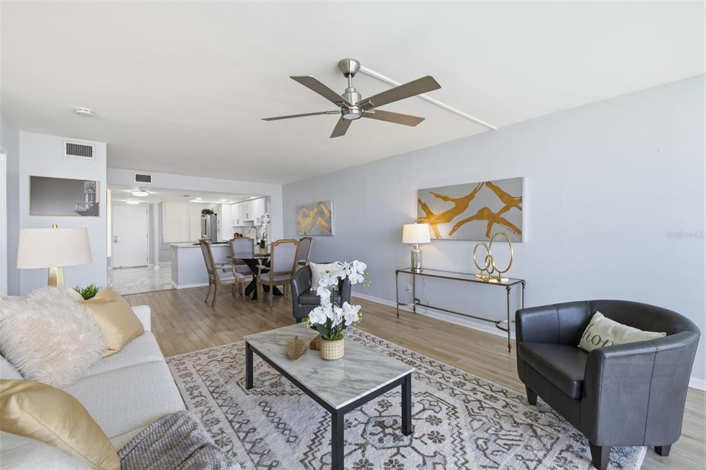 9495 Blind Pass Road, Unit 905 St. Pete Beach, FL 33706 - Photo 8 of 59 a living room with furniture and a rug