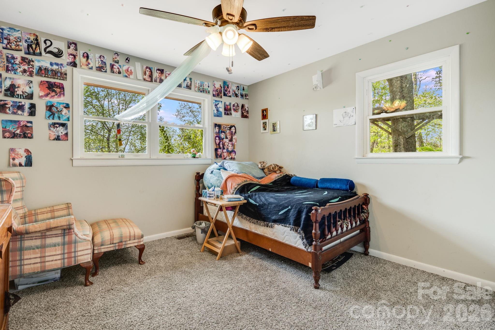 1737 Whiteside Road Forest City, NC 28043 - Photo 25 of 48 a room with furniture and a chandelier fan