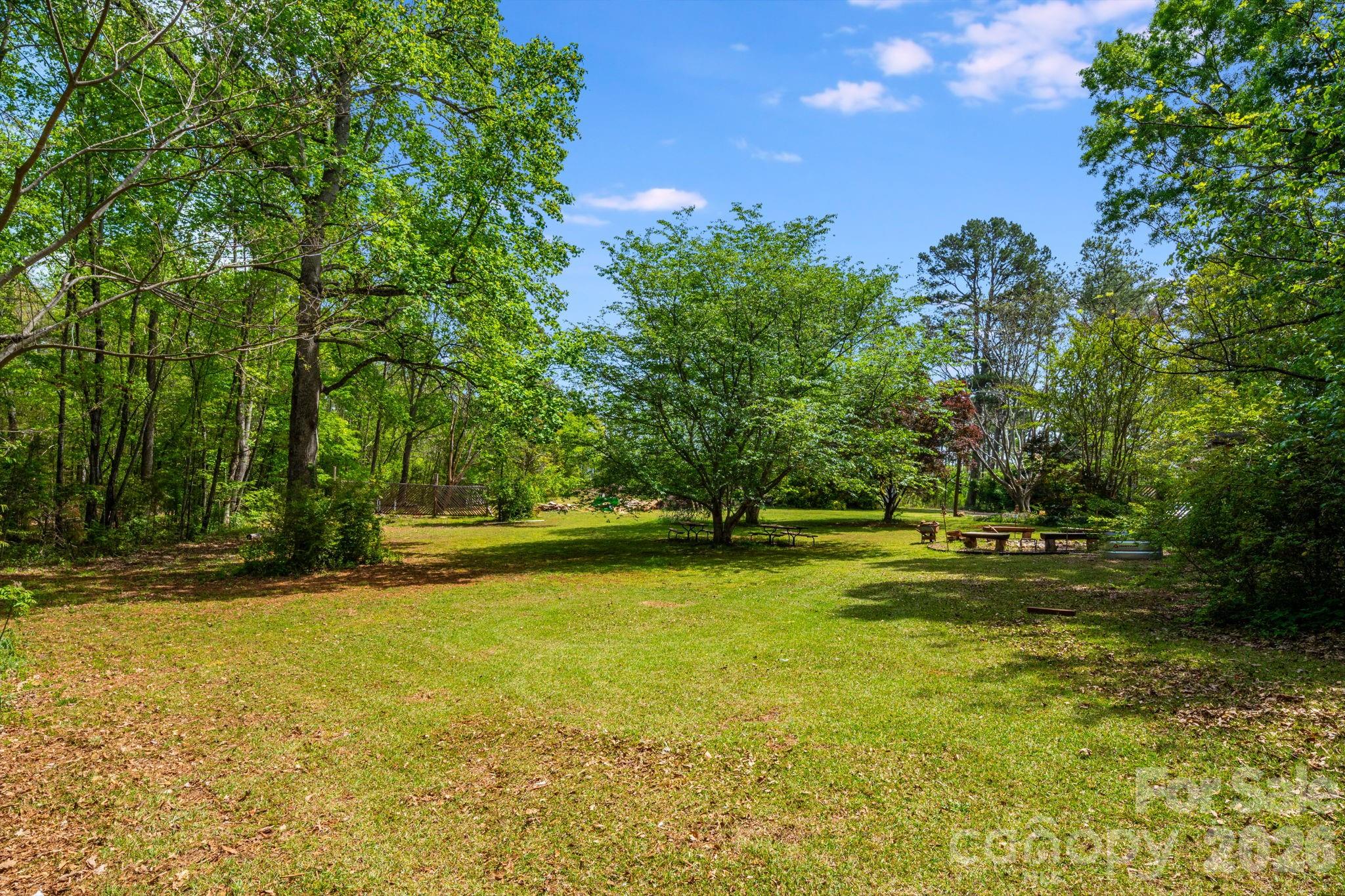 1737 Whiteside Road Forest City, NC 28043 - Photo 34 of 48 a view of a swimming pool with an outdoor space and seating area