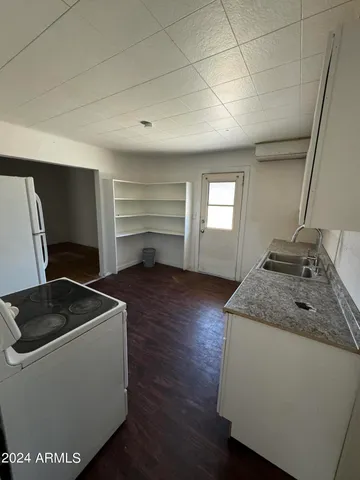 a room with chair and window