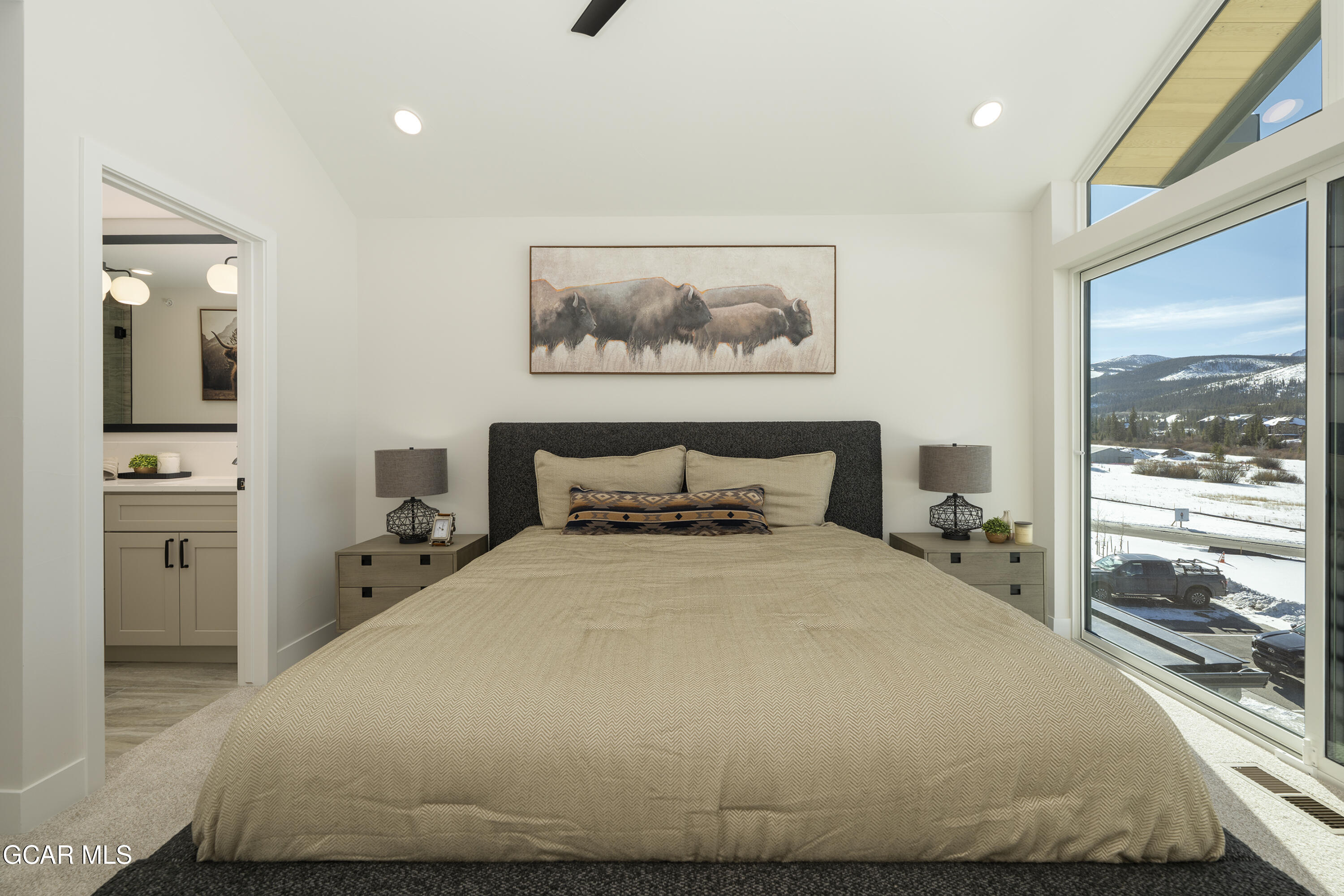 30 Wheeler Road Winter Park, CO 80482 - Photo 25 of 42 a bedroom with a bed and a large window