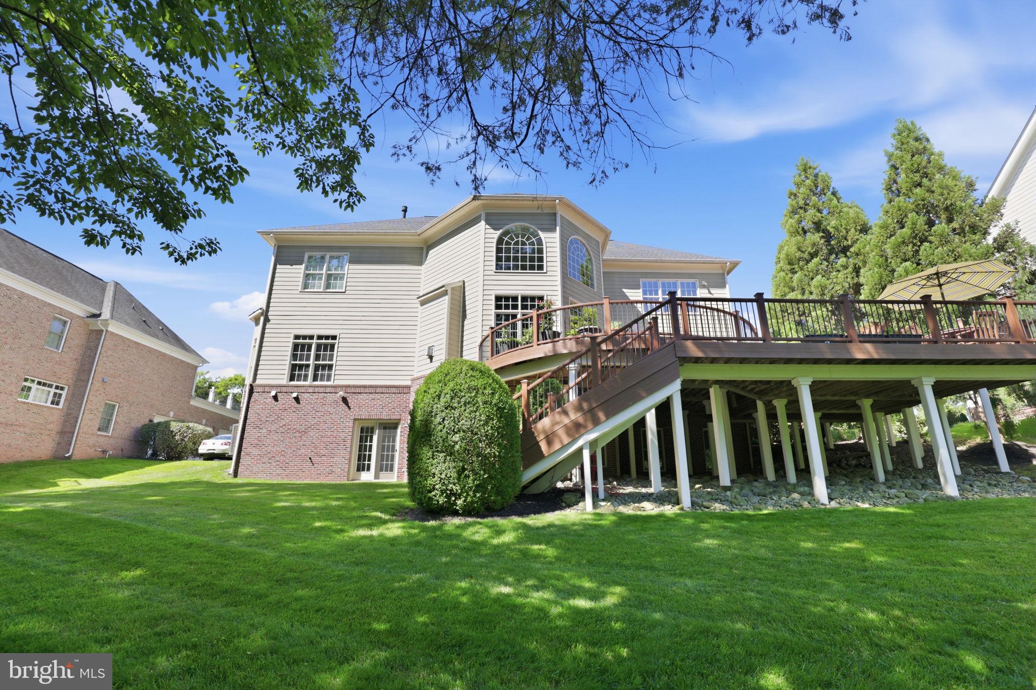 18856 Ridgeback Court Leesburg, VA 20176 - Photo 13 of 29 Multi-level deck with stairs to the lawn