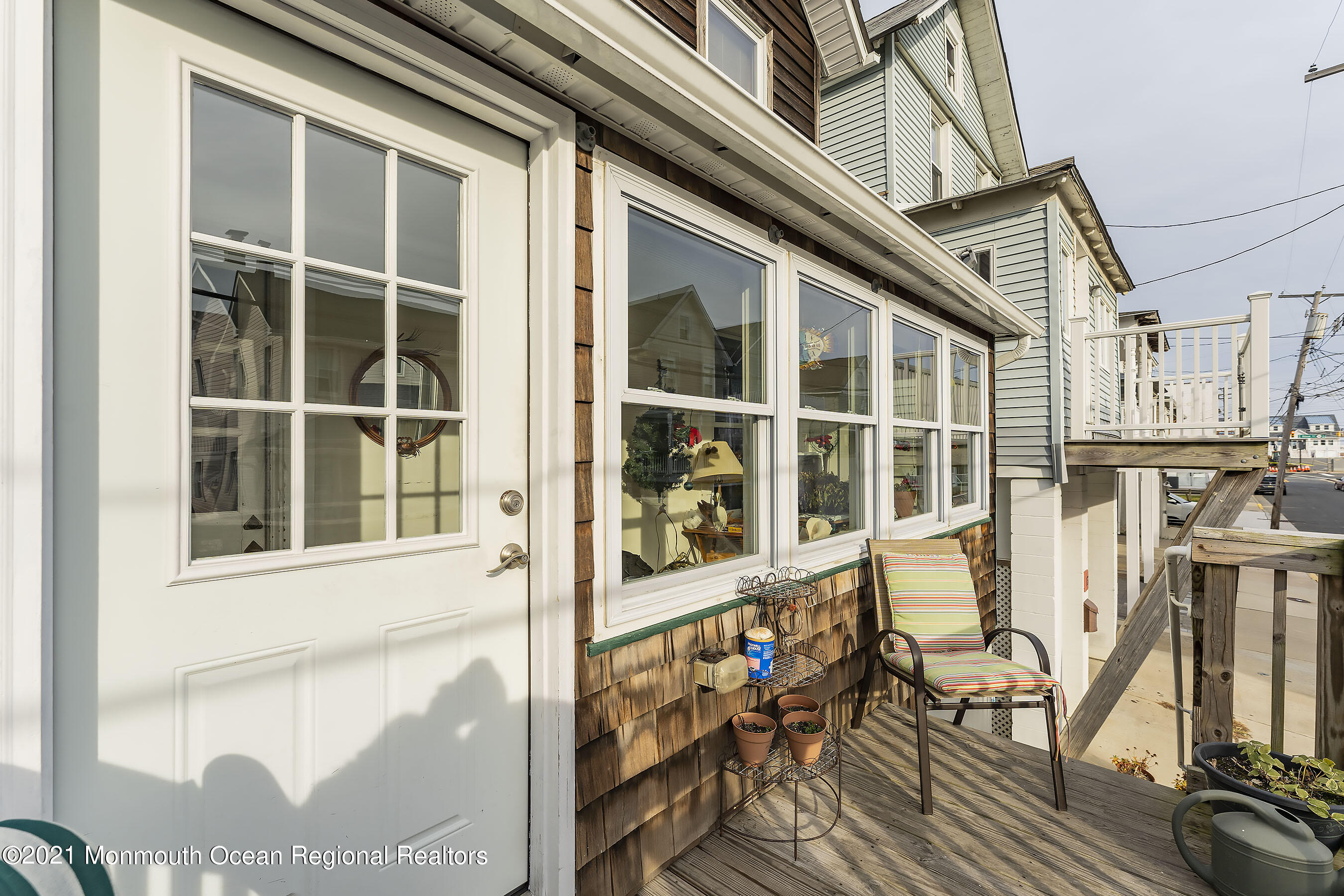 17 Center Street Sea Bright, NJ 07760 - Photo 2 of 23 a view of a balcony with wooden floor and outdoor seating