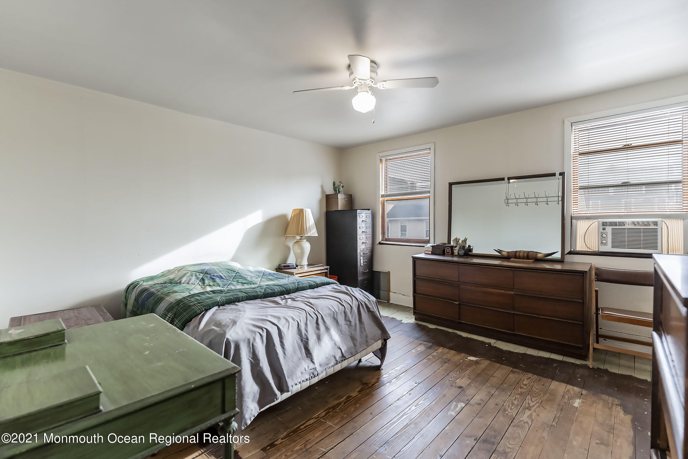 17 Center Street Sea Bright, NJ 07760 - Photo 11 of 23 a bedroom with a bed and a dresser