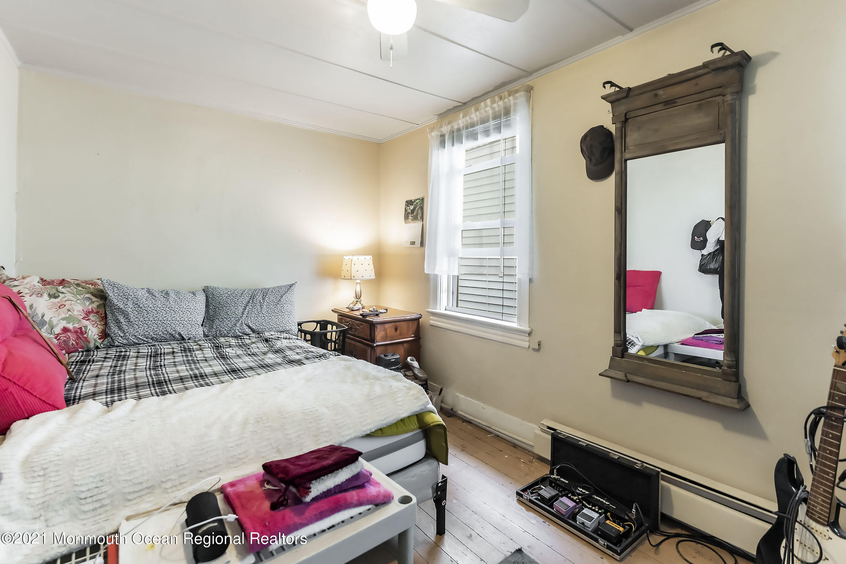 17 Center Street Sea Bright, NJ 07760 - Photo 12 of 23 a bedroom with a bed and a window