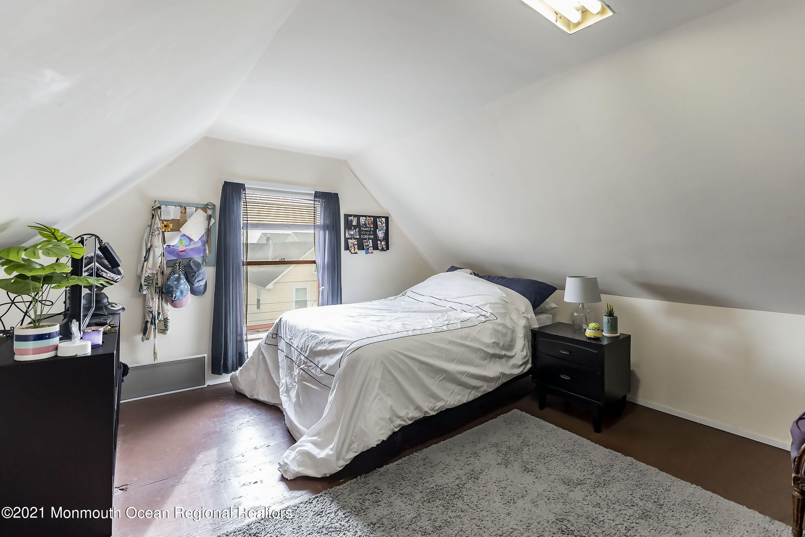 17 Center Street Sea Bright, NJ 07760 - Photo 14 of 23 a bedroom with a bed and a potted plant on the dresser