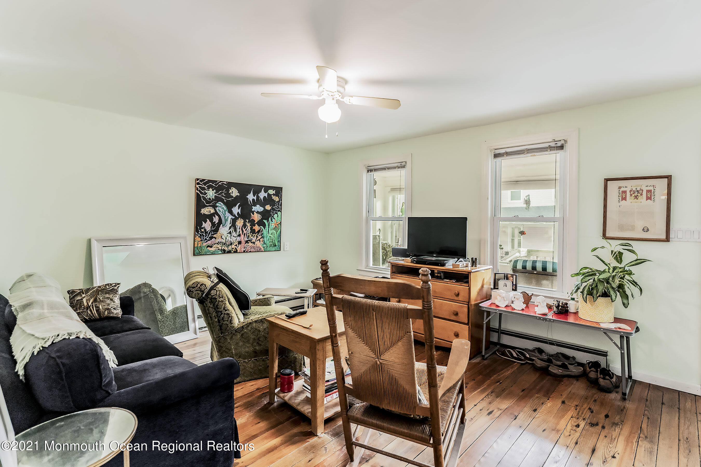 17 Center Street Sea Bright, NJ 07760 - Photo 4 of 23 a living room with furniture and a flat screen tv