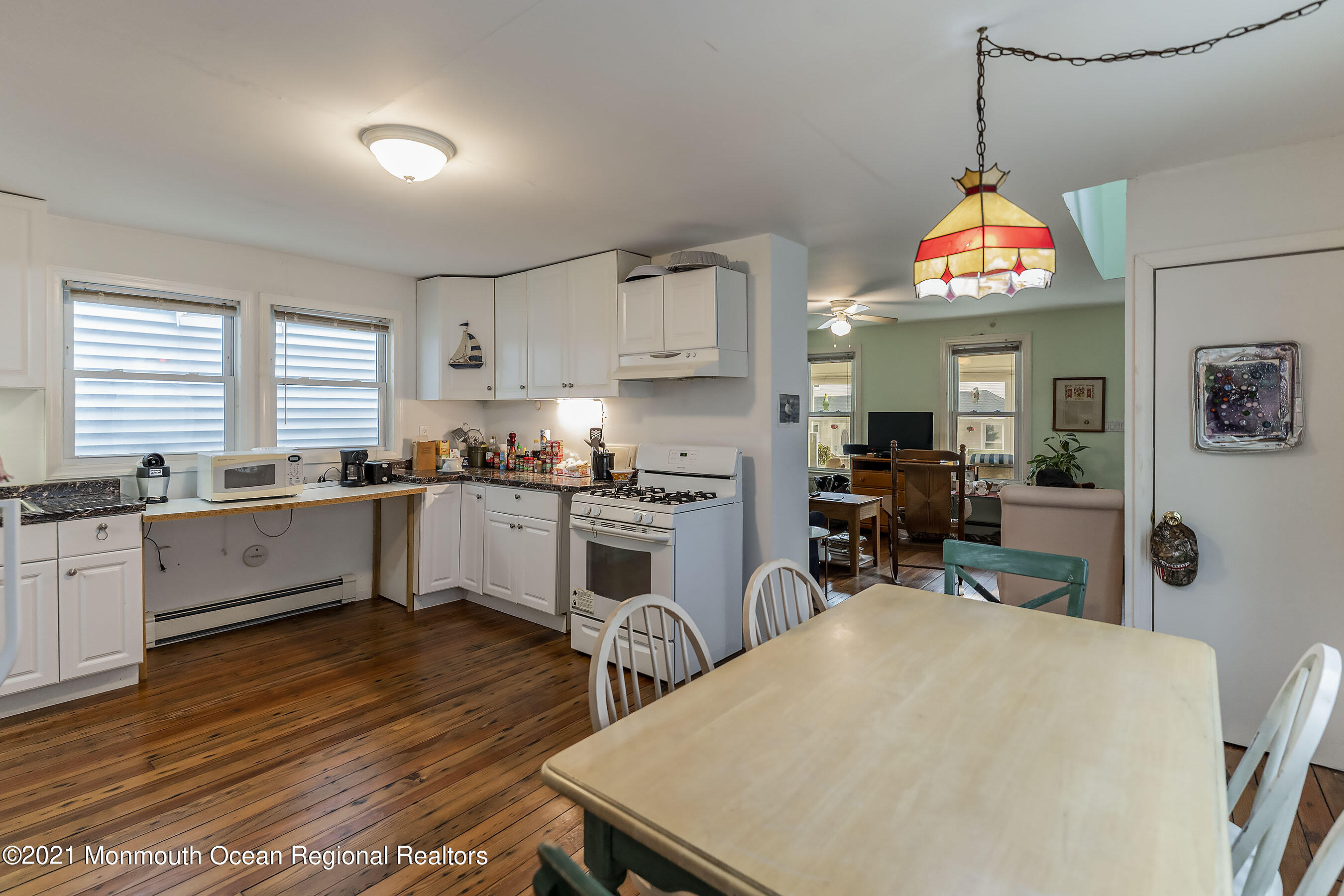 17 Center Street Sea Bright, NJ 07760 - Photo 6 of 23 a kitchen with white cabinets and sink