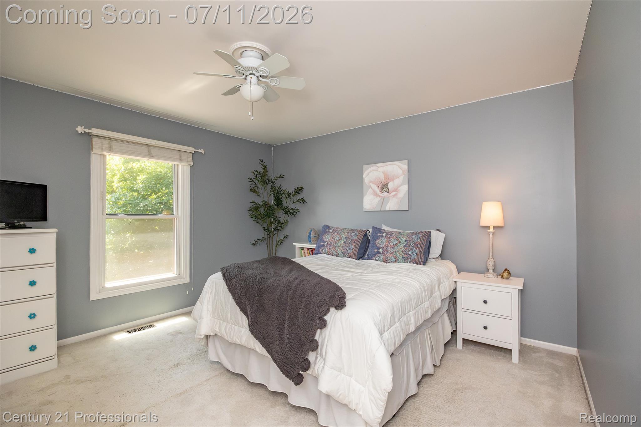 689 Woodfield Way Rochester, MI 48307 - Photo 25 of 61 Bedroom featuring light blue-gray walls, carpet flooring, a window with exterior views, and a ceiling fan