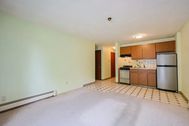 a kitchen with stainless steel appliances a refrigerator and a sink