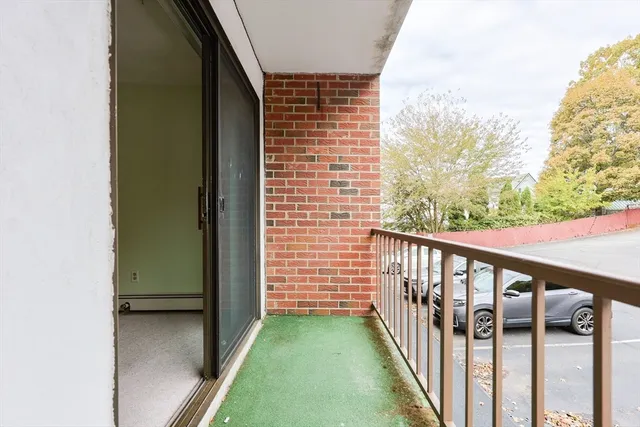 a view of balcony with furniture