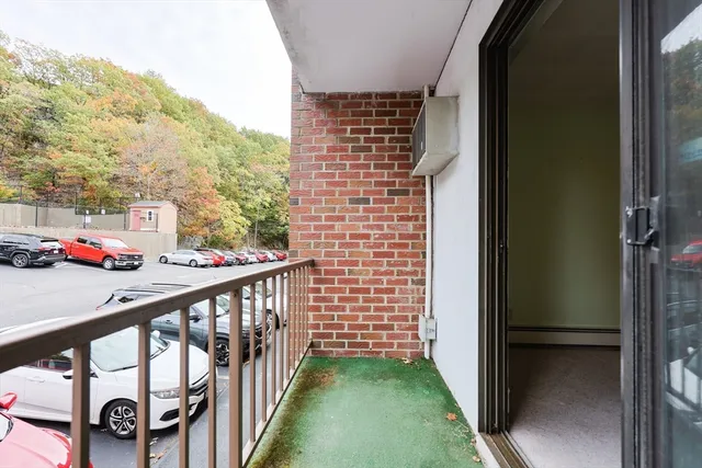 a view of staircase with a small yard