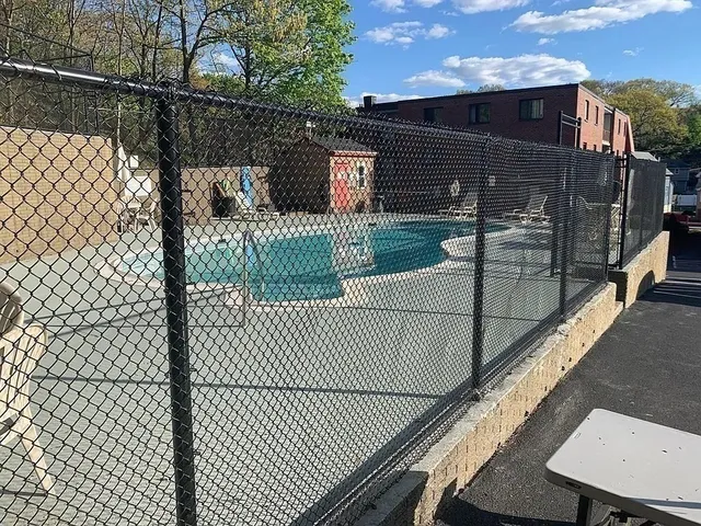 a view of storage and utility room with a hallway