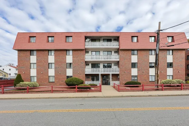 a view of a road with a building in the background